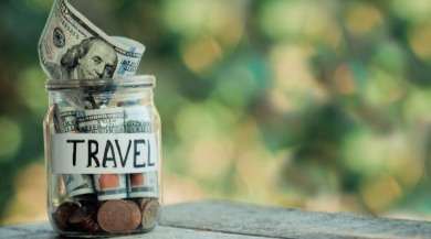 savings jar full of vacation money | Coastline Realty
