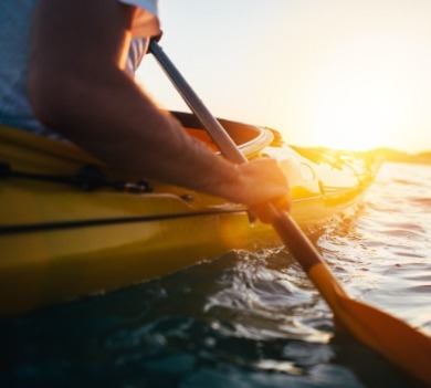 man kayaking | Coastline Realty Vacations